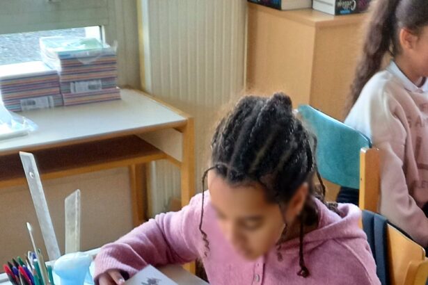 Students in a classroom with smartphones put away during a lesson